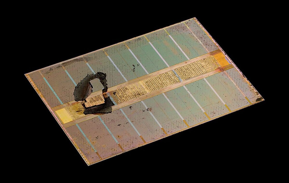 A single stacked DRAM die from a high-bandwidth memory (HBM) stack, photographed under magnification.